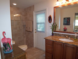 The second bath also opens to the pool